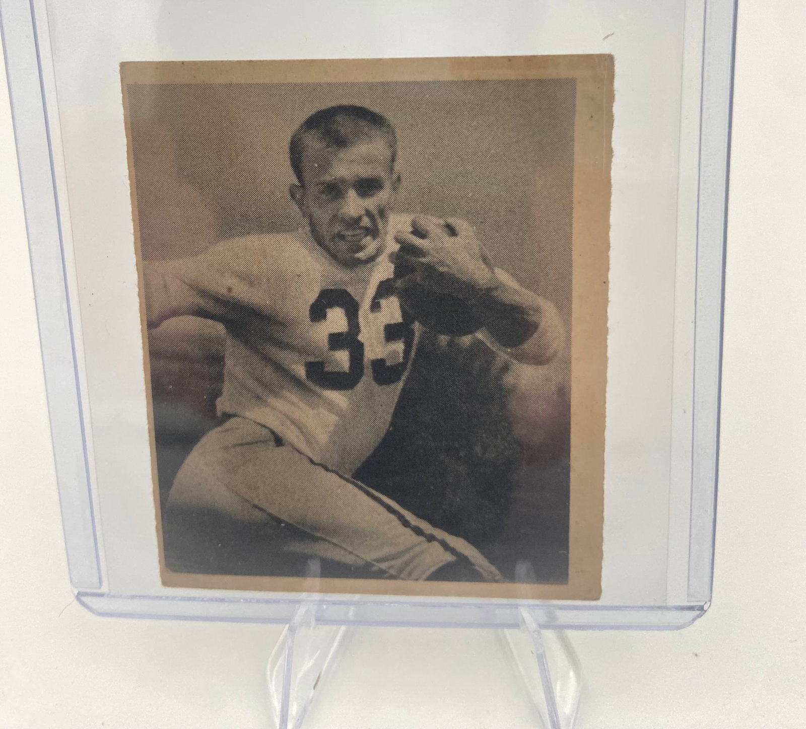 1948 Leaf Sammy Baugh Football Card: This is a 1948 Leaf football card featuring legendary Washington Redskins quarterback Sammy Baugh, wearing number 33. The card features a black and white portrait image and is encased in a protective