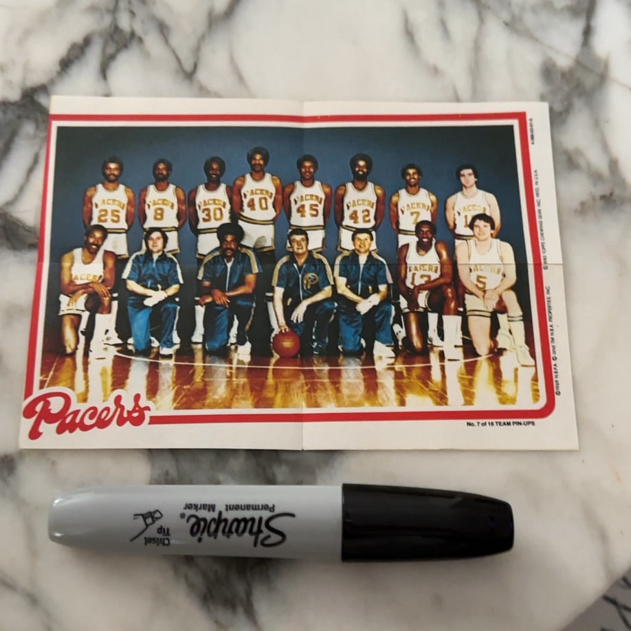 1983 Topps Indiana Pacers Team Pin-Up: a vintage 1983 Topps basketball team pin-up poster featuring the Indiana Pacers. It is marked as No. 7 of 16 in the set and features the team roster in their uniforms. The item is shown with a Sharpie