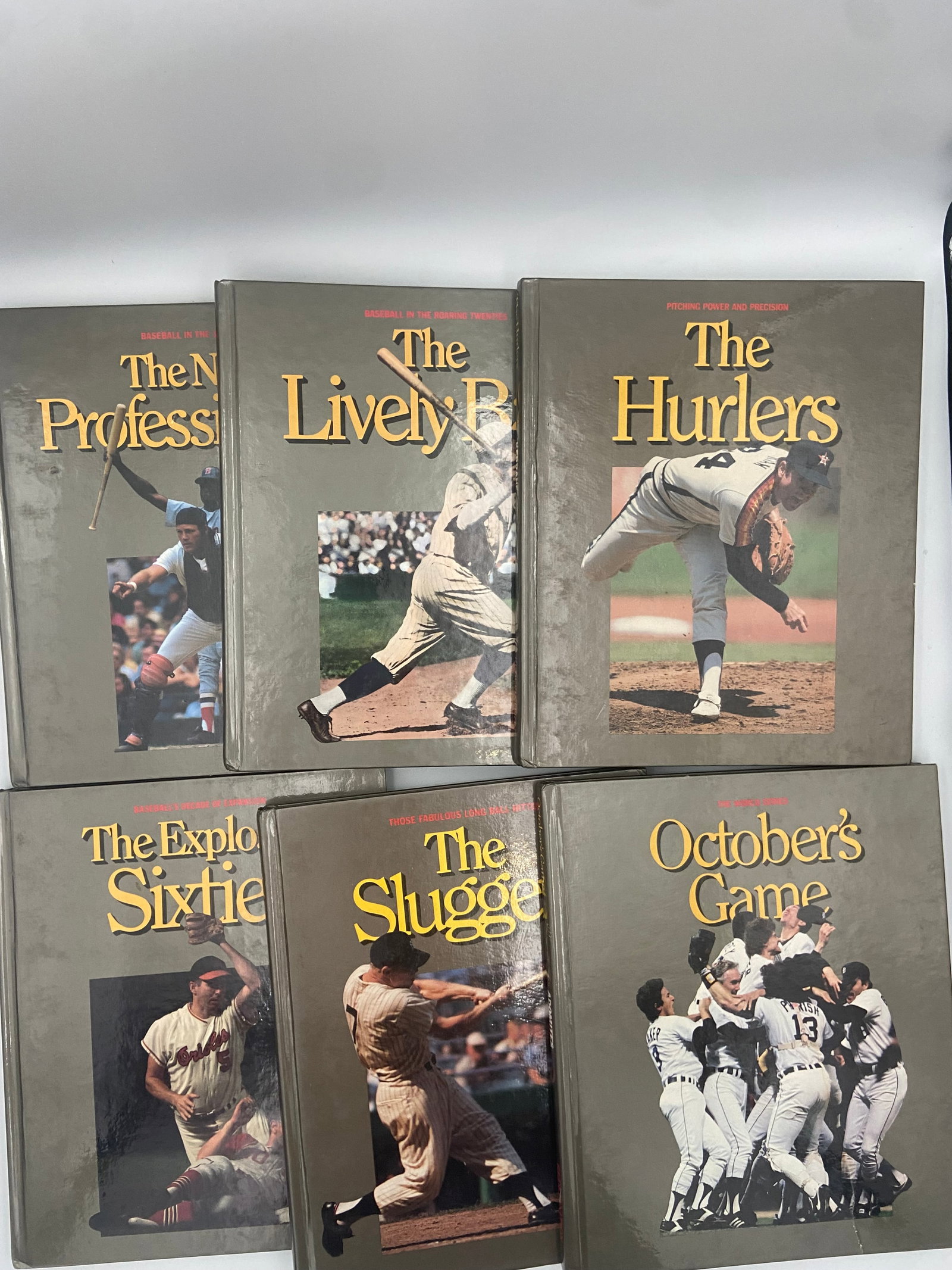 Macmillan Baseball Encyclopedia Series Books: A collection of six vintage baseball hardback books from the Macmillan series focusing on various aspects of baseball history. The set includes titles such as 'The Hurlers', 'October's Game', 'The Liv