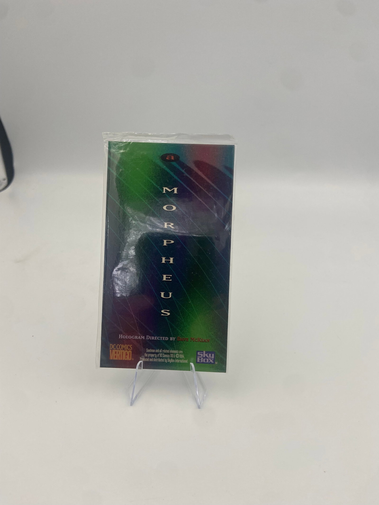 1994 Sandman Vertigo Morpheus Hologram Chase Card: promotional or chase hologram trading card featuring Morpheus from Neil Gaiman's The Sandman series. It is a DC Comics Vertigo release produced by SkyBox in 1994, featuring artwork by Dave McKean.