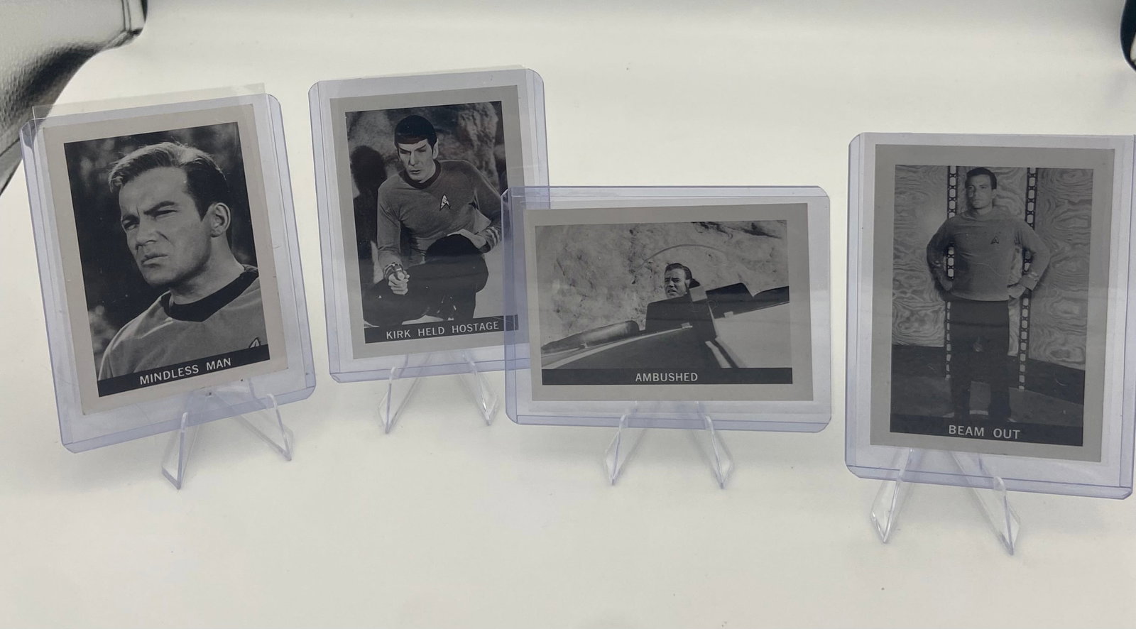 1967 Star Trek Trading Cards Lot: collection of four vintage 1967 Star Trek trading cards issued by Leaf. The cards are in black and white and feature iconic scenes and characters from the original television series,