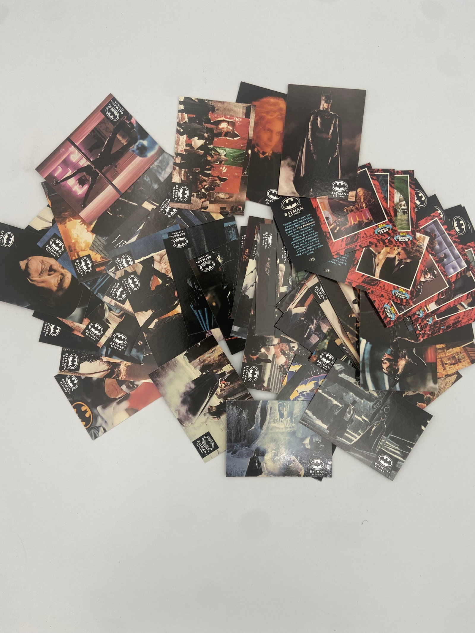 Batman Returns Topps Trading Card Collection: collection of assorted trading cards from the 1992 Batman Returns movie set. The cards feature various scenes, characters, and behind-the-scenes photography from the film produced by Topps. These