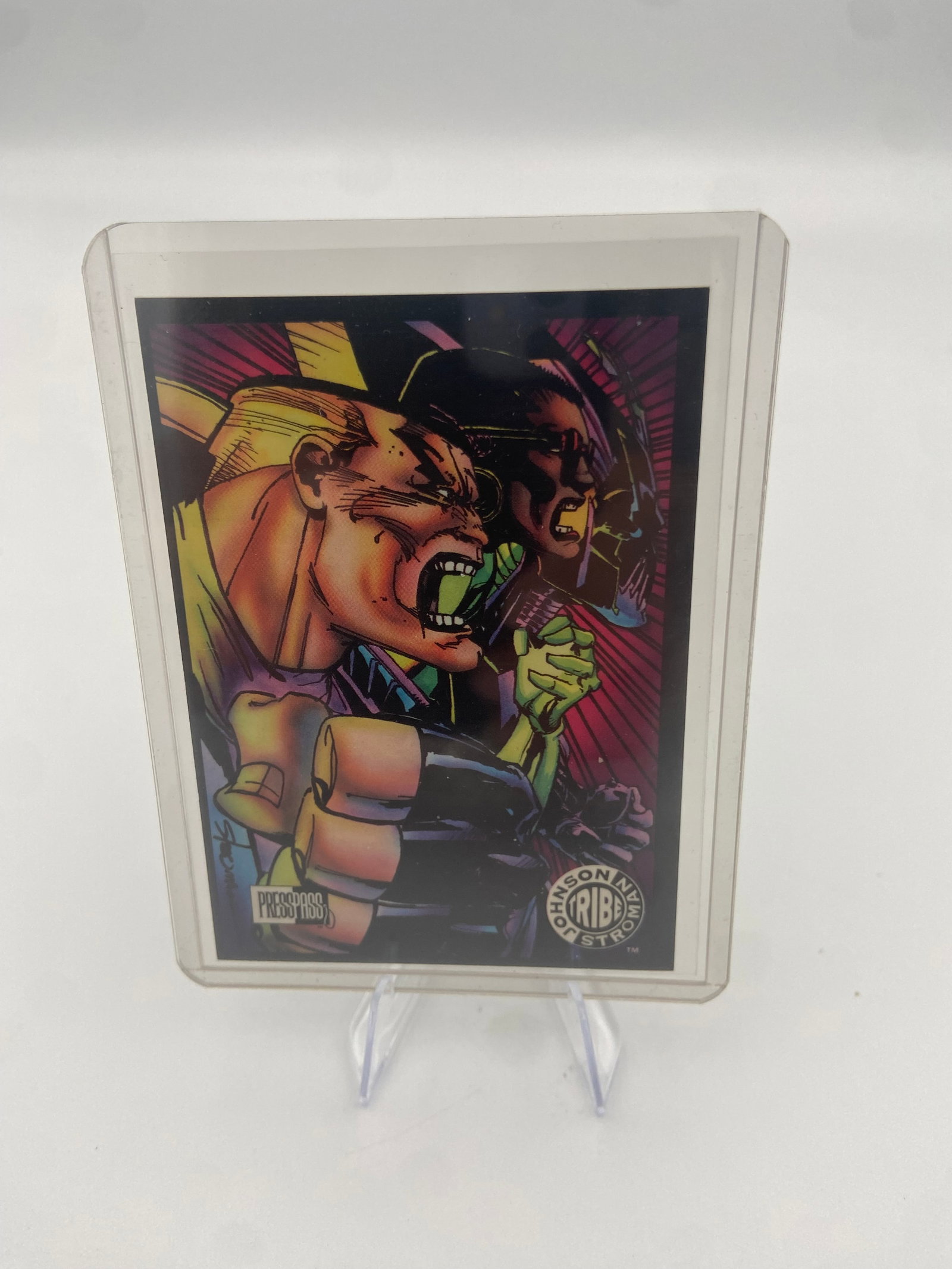 Johnson Stroman Tribe Trading Card: collectible trading card featuring artwork from the Johnson Stroman Tribe series. The card features vibrant, comic-style illustrations and is produced by Press Pass.