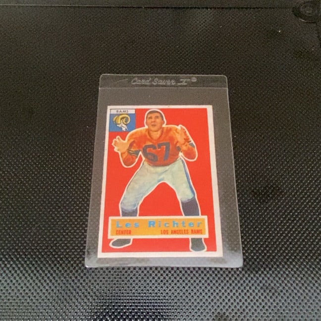 1954 Bowman Les Richter Los Angeles Rams Football Card: This is a 1954 Bowman football card featuring Los Angeles Rams player Les Richter. The card is preserved in a Card Saver I semi-rigid plastic sleeve. It displays the classic vintage design with the pl