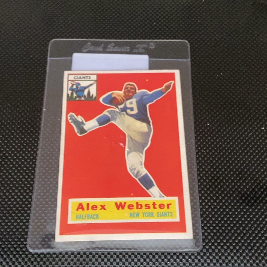 Vintage Alex Webster New York Giants Trading Card: This is a 1961 Topps football card featuring Alex Webster of the New York Giants. The card highlights the player in a dynamic action pose against a vibrant red background and is preserved in a