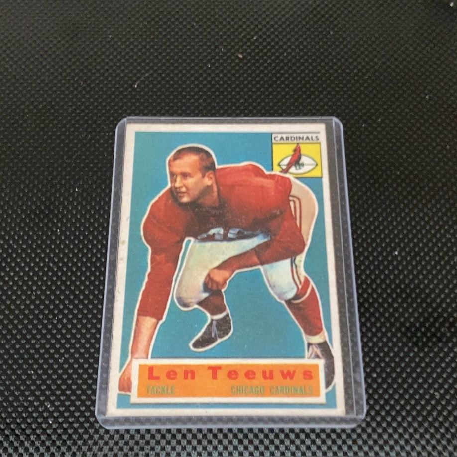 Vintage Len Teeuws Chicago Cardinals Tackle Sports Card: This is a 1953 Bowman football card featuring offensive tackle Len Teeuws of the Chicago Cardinals. The vintage collectible showcases a classic illustrated portrait of the player in his red jersey aga
