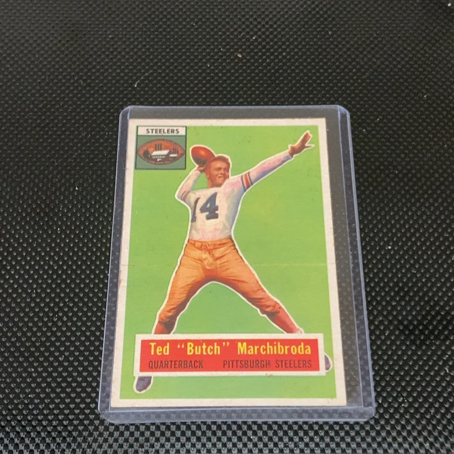 Vintage Ted Marchibroda Pittsburgh Steelers Football Card: This is a 1957 Topps football card featuring quarterback Ted 'Butch' Marchibroda of the Pittsburgh Steelers. The vintage card displays a classic illustrated design on a distinctive green background,