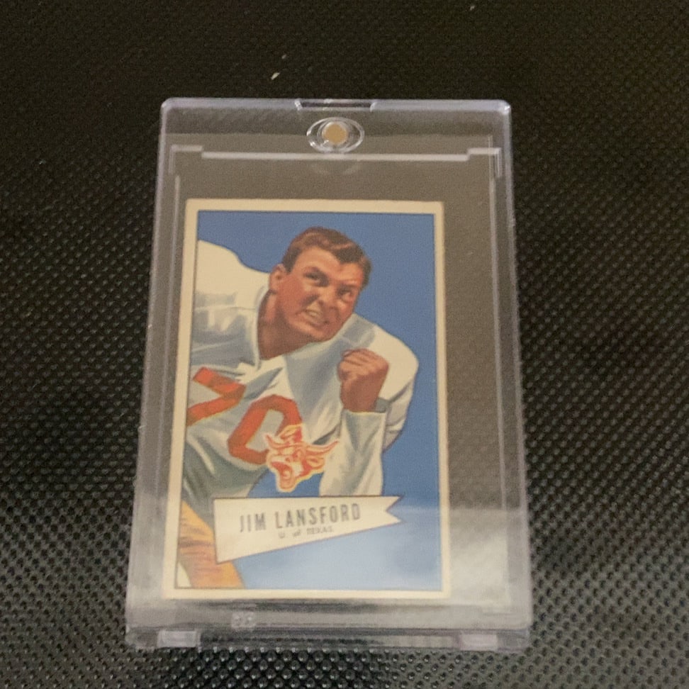 1955 Topps All-American Jim Lansford Football Card: This is a 1955 Topps All-American football card featuring Jim Lansford from the University of Texas. The card is encased in a protective magnetic holder and appears to be in very good condition with c