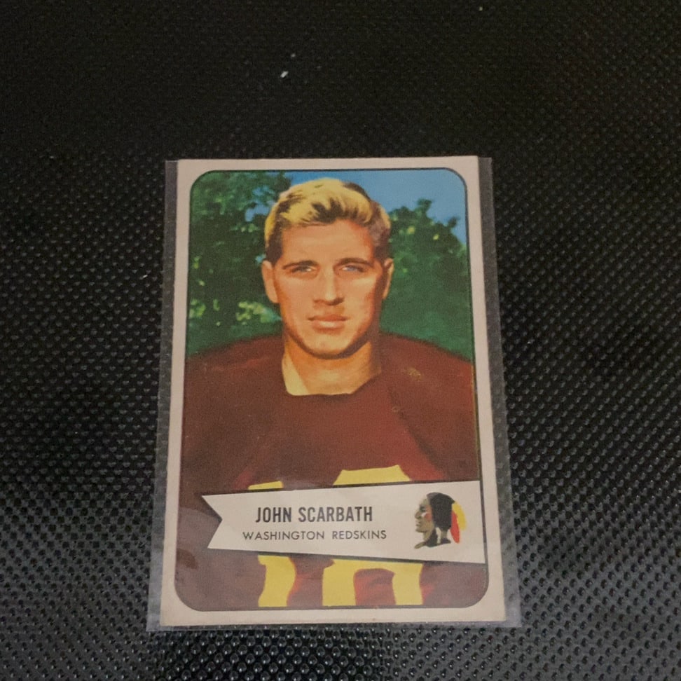 1955 Topps All-American John Scarbath Football Card: This is a 1955 Topps All-American football card featuring John Scarbath of the Washington Redskins. The card displays a portrait of the player against a green background with a banner containing his n