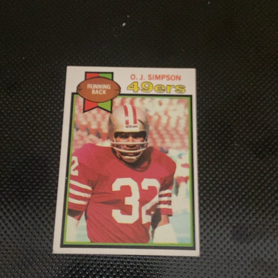 1979 Topps O.J. Simpson San Francisco 49ers Card: This is a 1979 Topps O.J. Simpson football card, representing his tenure with the San Francisco 49ers. The card features a portrait of the running back in his team uniform and appears to be in good