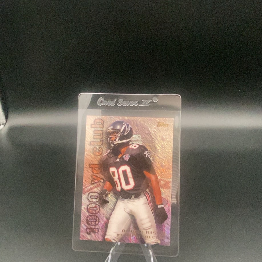 Topps 1000 yd club Andre Rison: This is a Topps trading card featuring Andre Rison as part of the 1000 yd club insert set. The card shows Rison in his Atlanta Falcons uniform and is protected in a Card Saver III sleeve.