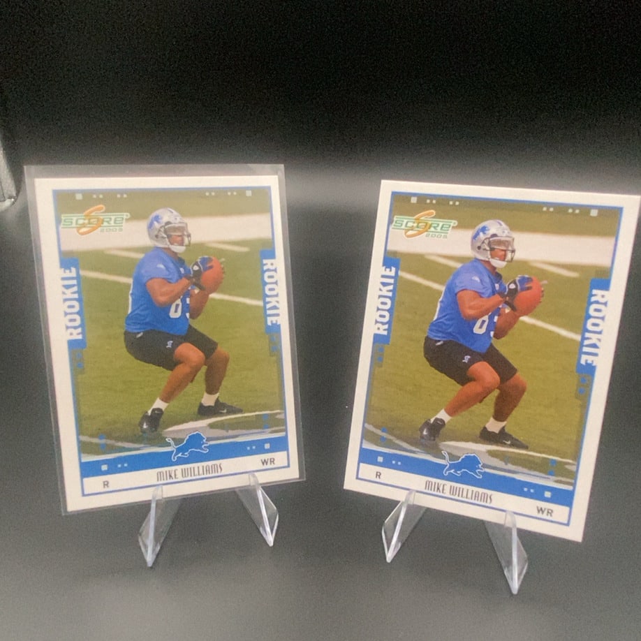 2005 Score Mike Williams: This is a 2005 Score rookie trading card featuring Mike Williams of the Detroit Lions. The card showcases action photography of the wide receiver on the field. There are two copies of this card shown