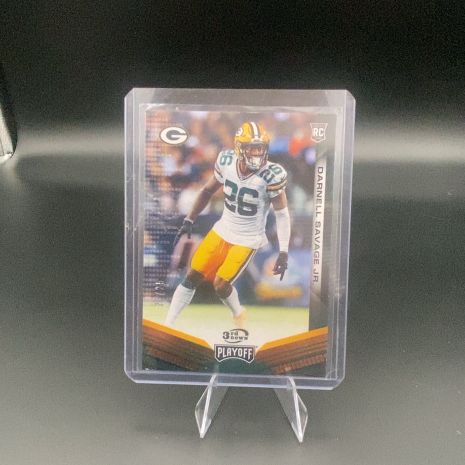 2019 Playoff Darnell Savage Jr.: This is a 2019 Playoff rookie football card featuring Darnell Savage Jr. of the Green Bay Packers. The card is encased in a protective sleeve and top loader, identifying it as a 3rd Down insert from