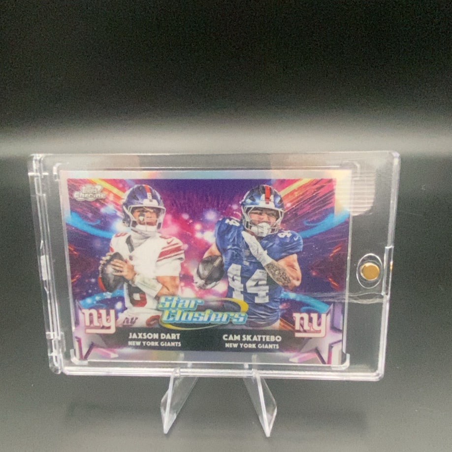 2024 Topps Chrome Star Clusters Jaxson Dart Cam Skattebo: This is a 2024 Topps Chrome Star Clusters trading card featuring college football players Jaxson Dart and Cam Skattebo. The card showcases a vibrant, foil-like design and is encased in a protective