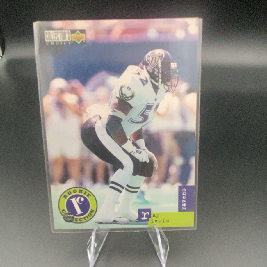 1996 Collector's Choice Ray Lewis: This is a 1996 Collector's Choice trading card featuring Ray Lewis of the Baltimore Ravens. The card features a Rookie Collection design element, highlighting his status as a rookie player in the NFL.