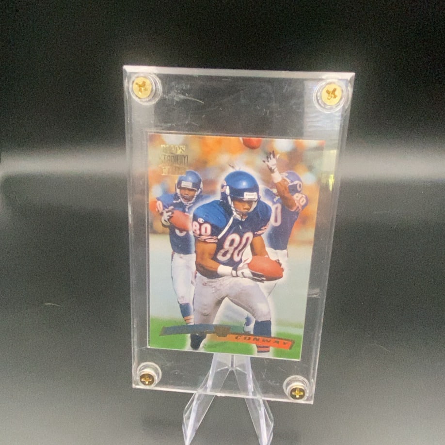 Topps Stadium Club Kevin Conway: This is a Topps Stadium Club football trading card featuring Kevin Conway wearing his team uniform. The card is encased in a protective screw-down plastic holder.