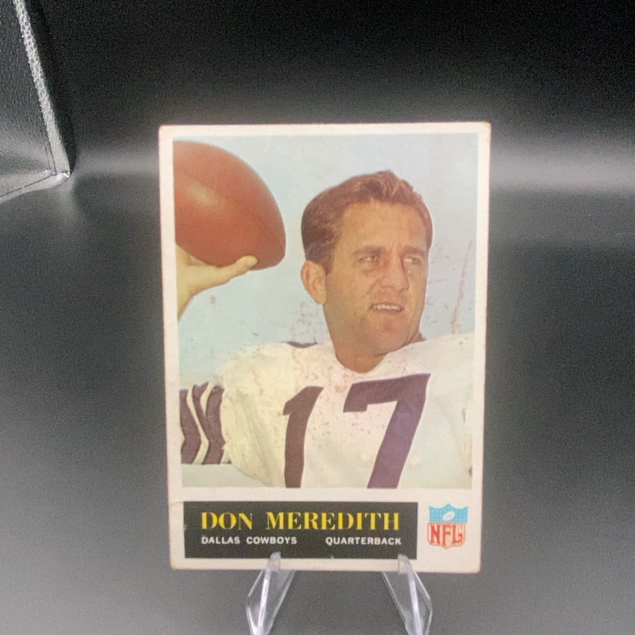 Don Meredith Dallas Cowboys Quarterback: This is a vintage trading card featuring Don Meredith, the quarterback for the Dallas Cowboys. The card displays a front-facing photograph of the player ready to pass a football. The NFL logo is