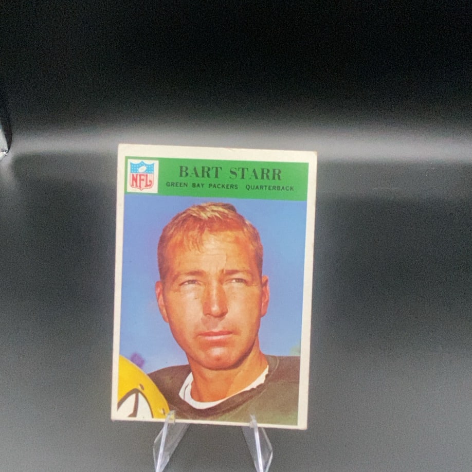 Vintage Bart Starr Green Bay Packers Trading Card: This is a vintage trading card featuring Bart Starr of the Green Bay Packers. He is listed on the card as a Quarterback.
