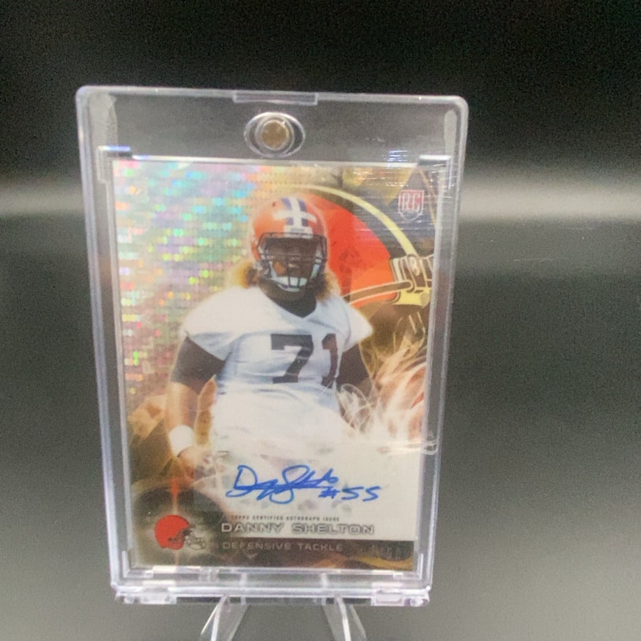 2015 Topps Danny Shelton: This is a 2015 Topps Certified Autograph Issue football card featuring Danny Shelton, a defensive tackle for the Cleveland Browns. The card includes a blue ink hand-signed autograph and is encased in