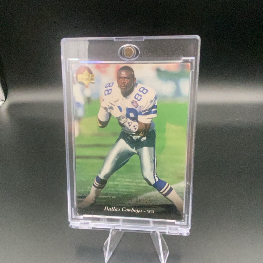 1994 Upper Deck Michael Irvin: This is a 1994 Upper Deck football card featuring Michael Irvin of the Dallas Cowboys. The card shows Irvin in his team uniform and is protected in a magnetic card holder.