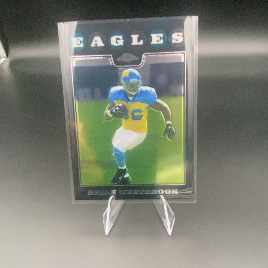 2004 Topps Chrome Brian Westbrook: This is a 2004 Topps Chrome football card featuring Brian Westbrook of the Philadelphia Eagles. The card showcases the player in action and utilizes the distinctive Topps Chrome finish.
