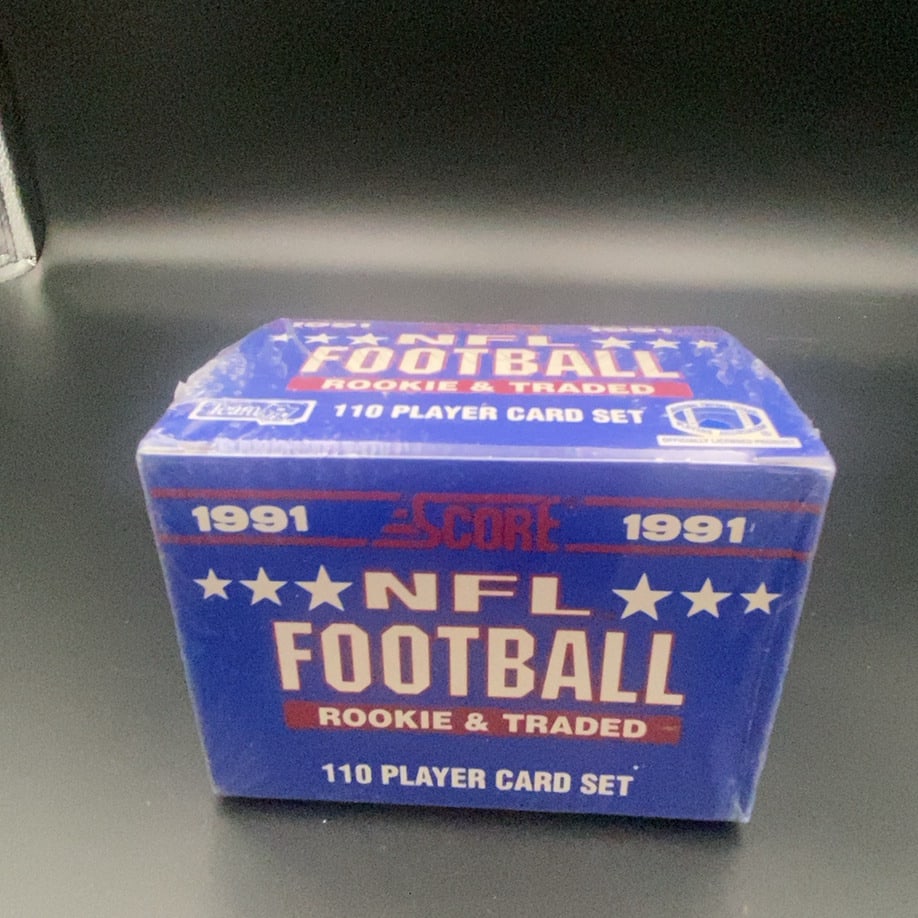 1991 Score NFL Football Rookie & Traded Card Set: This is a sealed 1991 Score NFL Football Rookie & Traded card set. The box contains 110 player cards and is an officially licensed NFL product.