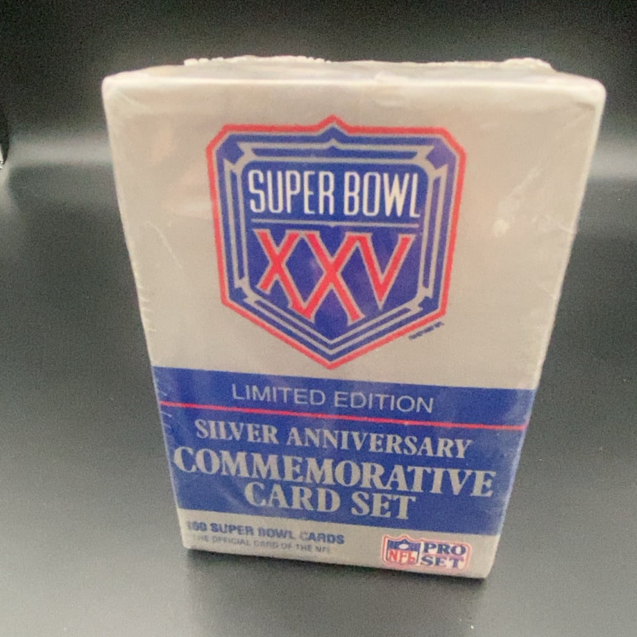 Pro Set Super Bowl XXV Silver Anniversary Commemorative Set: This is a factory-sealed Limited Edition Super Bowl XXV Silver Anniversary Commemorative Card Set by Pro Set. It contains 100 Super Bowl cards and is an official NFL product. The packaging highlights
