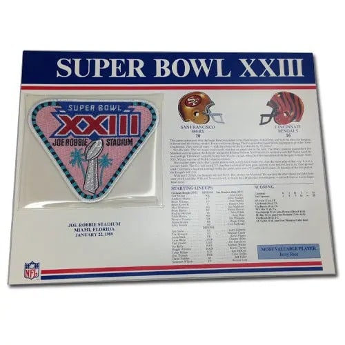 1989 Super Bowl XXIII Patch With Header Board: This is a collectible patch from the 1989 Super Bowl XXIII game, featuring the official game logo. The patch is mounted on a commemorative header board that details the starting lineups, scores, and