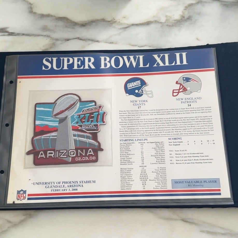 Super Bowl XLII Collector Patch: This is a Super Bowl XLII commemorative collector sheet featuring a patch of the Vince Lombardi Trophy. It provides detailed game stats, starting lineups for the New York Giants and New England Patrio
