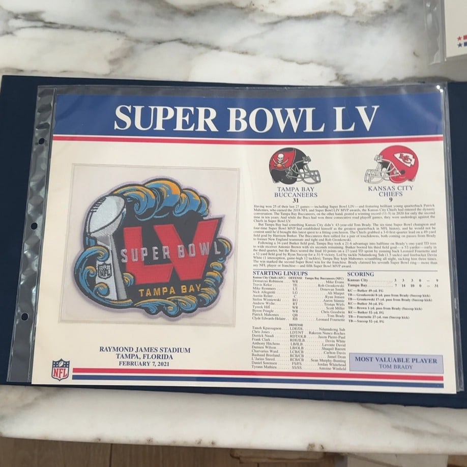 Super Bowl LV Commemorative Sheet: This collectible commemorative sheet highlights Super Bowl LV held on February 7, 2021, at Raymond James Stadium. It features a decorative patch logo for the game, as well as the starting lineups,