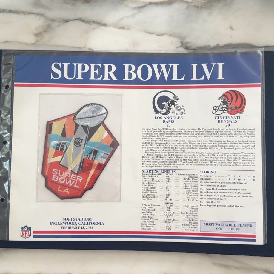 2022 Super Bowl LVI Commemorative Patch: This is a Super Bowl LVI commemorative patch and informational display piece celebrating the game held in 2022 at SoFi Stadium. The item features an embroidered patch of the Super Bowl trophy along