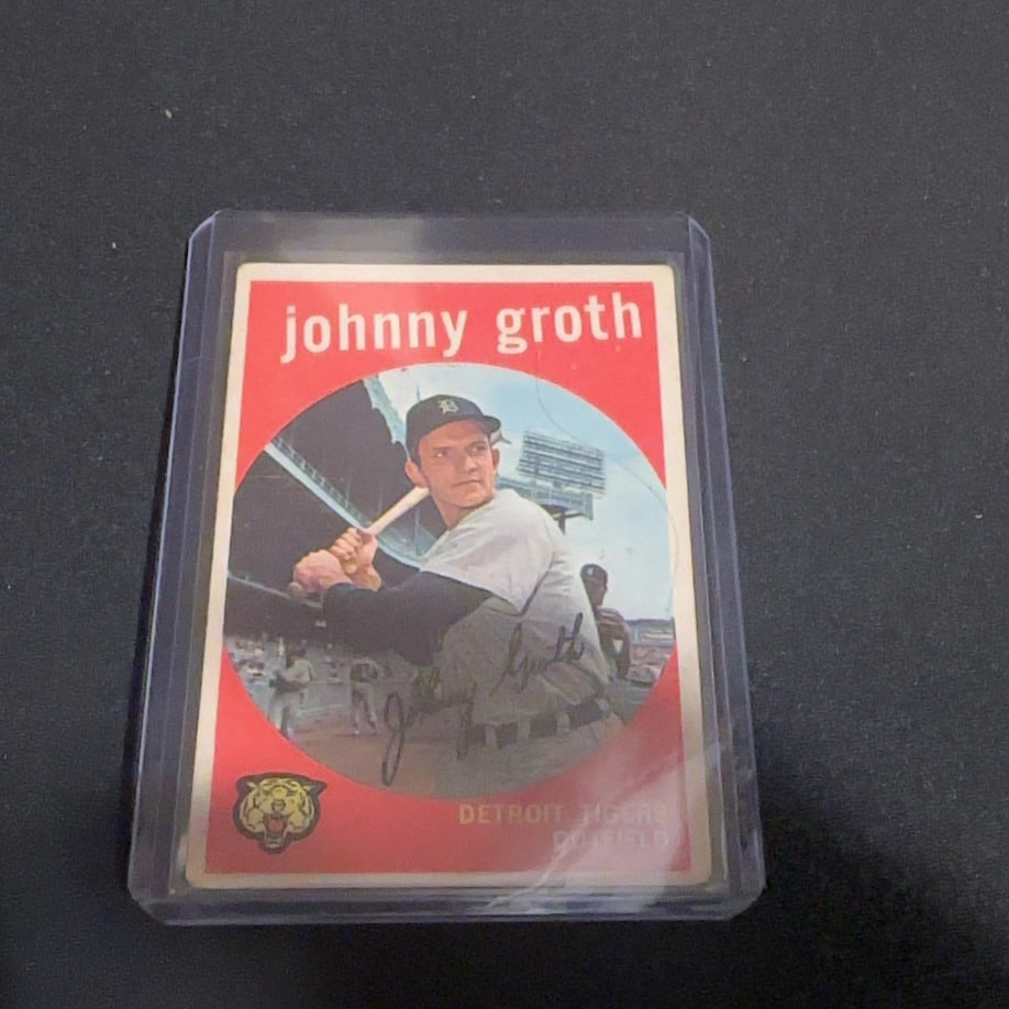 1959 Vintage Topps Johnny Groth Detroit Tigers Autographed Card: This is a 1959 Vintage Topps baseball card featuring Johnny Groth of the Detroit Tigers. The card is showcased in a protective plastic top loader and includes an authentic-looking autograph across