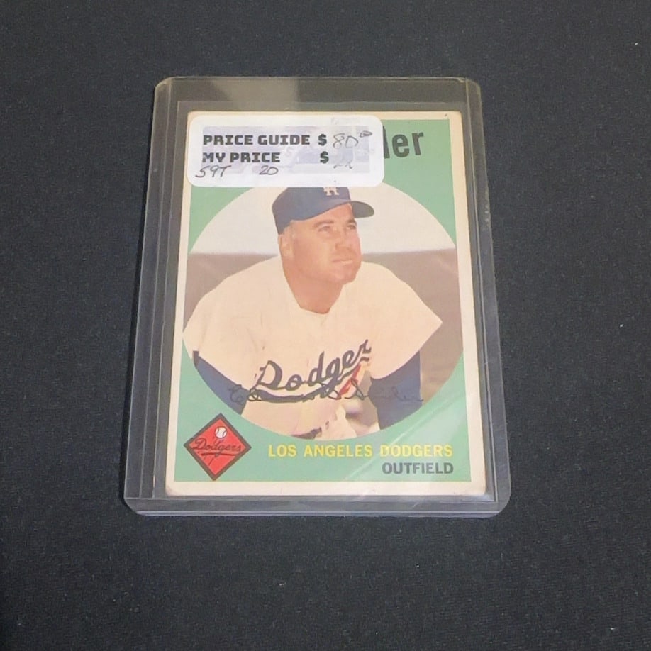 1959 Topps Duke Snider: This is a 1959 Topps baseball card featuring Los Angeles Dodgers outfielder Duke Snider. The card displays a portrait of the player with the Dodgers team name and position printed on the front. A
