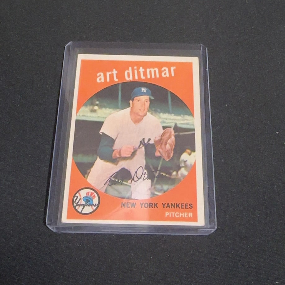 1959 Vintage Topps Art Ditmar: This is a 1959 Vintage Topps trading card featuring New York Yankees pitcher Art Ditmar. The front shows a vintage portrait of the player with his name and team information clearly displayed.