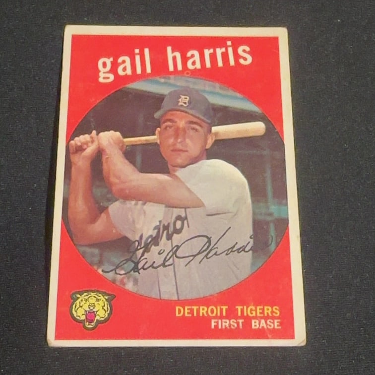 Gail Harris Detroit Tigers: This is a vintage baseball card featuring Gail Harris of the Detroit Tigers. The player is depicted in a batting stance with a Tigers logo and position information displayed at the bottom.