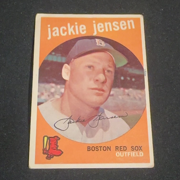 Vintage Jackie Jensen Boston Red Sox Baseball Card: This is a vintage baseball card featuring Jackie Jensen of the Boston Red Sox. The card showcases a portrait of the player and a facsimile signature, along with the team name and position.