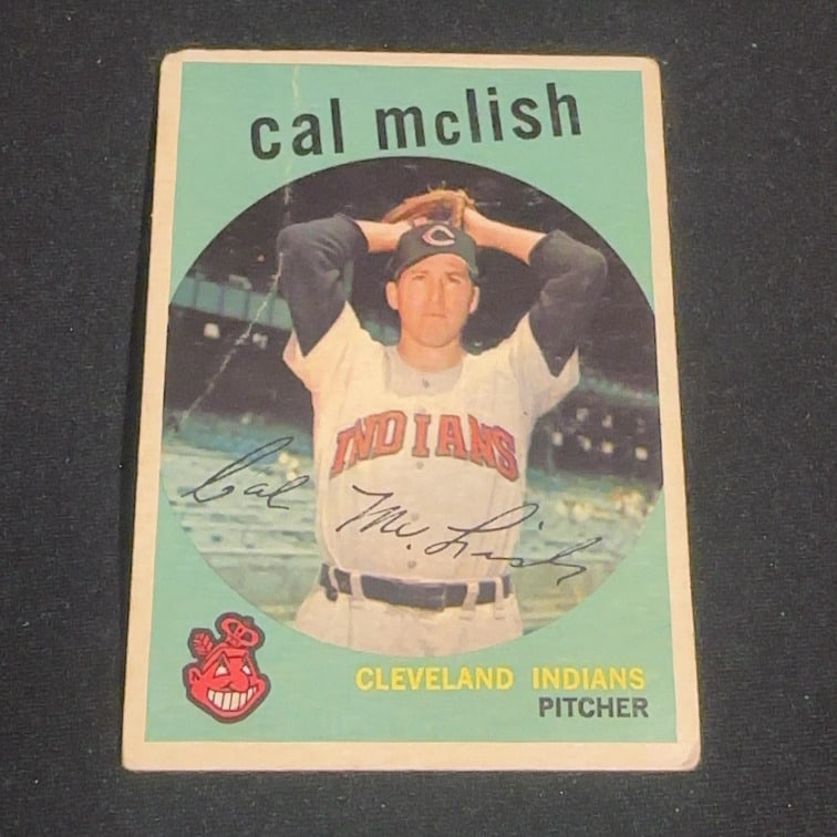 Vintage Cal McLish Cleveland Indians Baseball Card: This is a vintage baseball card featuring Cal McLish of the Cleveland Indians. He is depicted as a pitcher in his uniform on the front of the card. The card features a facsimile signature of the