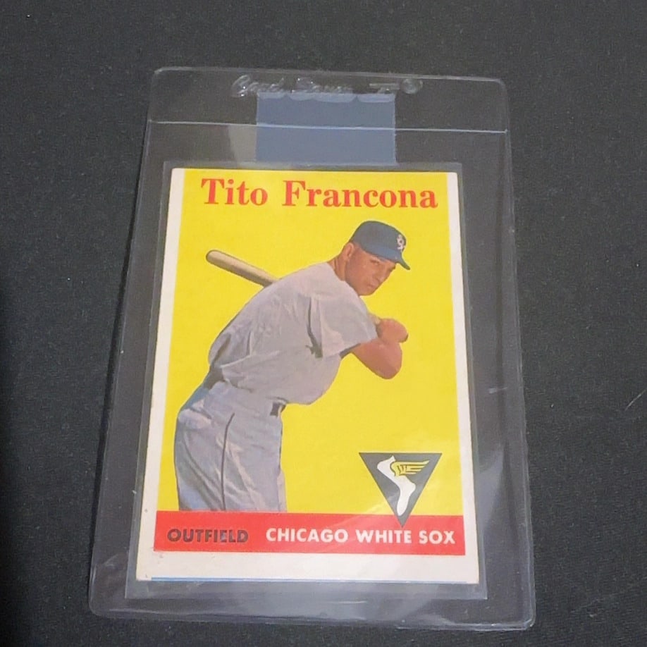 Vintage Tito Francona Chicago White Sox Baseball Card: This is a vintage baseball card featuring Tito Francona, who is identified as an outfielder for the Chicago White Sox. The card design features a bold yellow background and prominently displays the pl