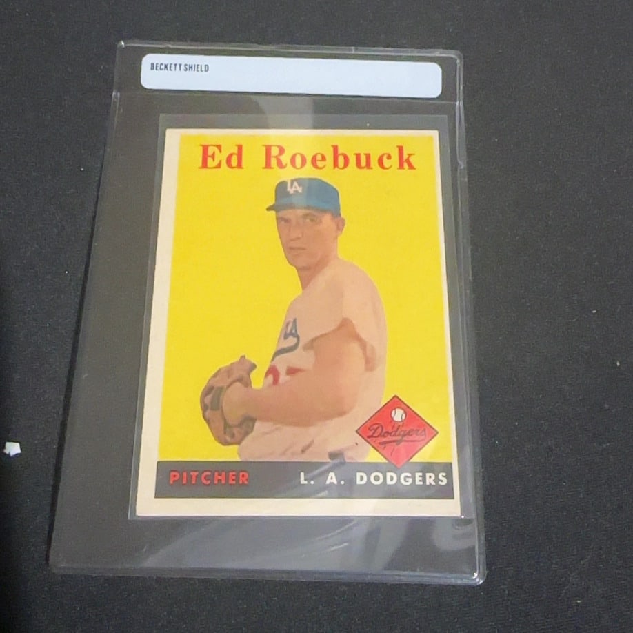 1958 Vintage Ed Roebuck Los Angeles Dodgers Baseball Card: This is a 1958 Vintage baseball card featuring Ed Roebuck of the Los Angeles Dodgers. The card identifies him as a pitcher for the L.A. Dodgers and is encased in a Beckett Shield protective holder.