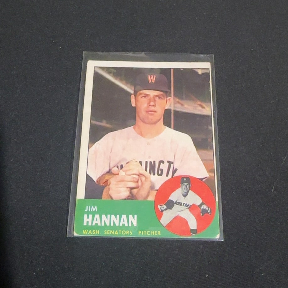 1963 Topps Jim Hannan: This is a 1963 Topps baseball card featuring Washington Senators pitcher Jim Hannan. The card displays a portrait of the athlete alongside a circular action shot insert at the bottom right corner.