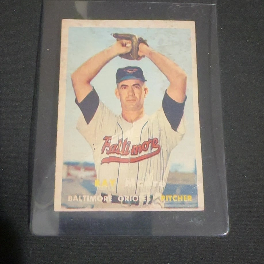 1957 Vintage Topps Ray Moore: 1957 Vintage Topps baseball card featuring Baltimore Orioles pitcher Ray Moore. The card displays a color photograph of the player in his uniform and includes his name and position printed at the bott