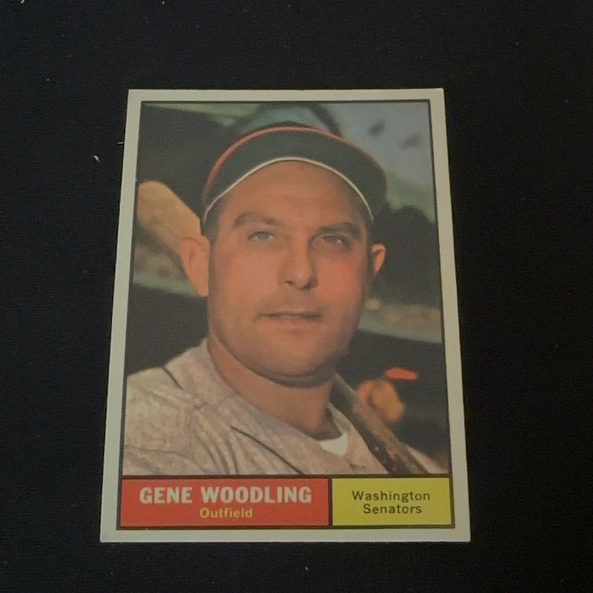 Gene Woodling Washington Senators: This is a vintage baseball card featuring Gene Woodling playing for the Washington Senators. The card displays his name and position as an outfielder in the bottom red banner and his team name in the