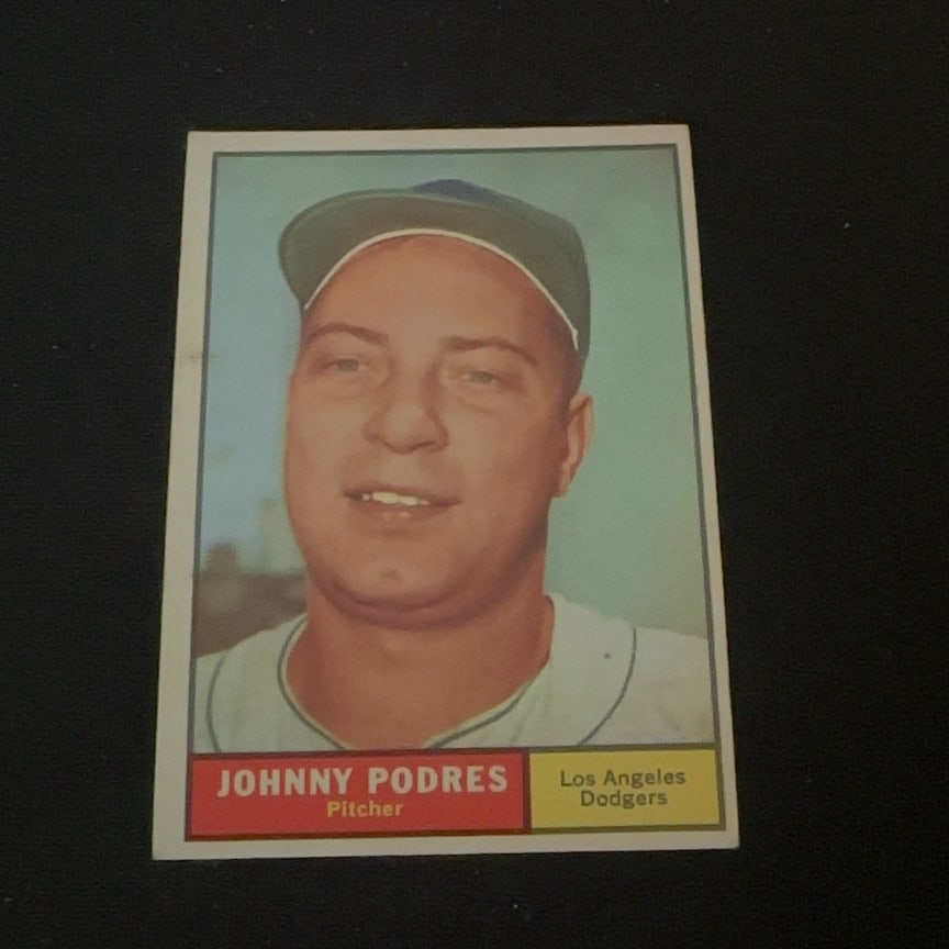 Johnny Podres Los Angeles Dodgers: This is a vintage baseball card featuring Johnny Podres of the Los Angeles Dodgers. The player is identified as a pitcher, and the card design features a portrait photograph with name and team