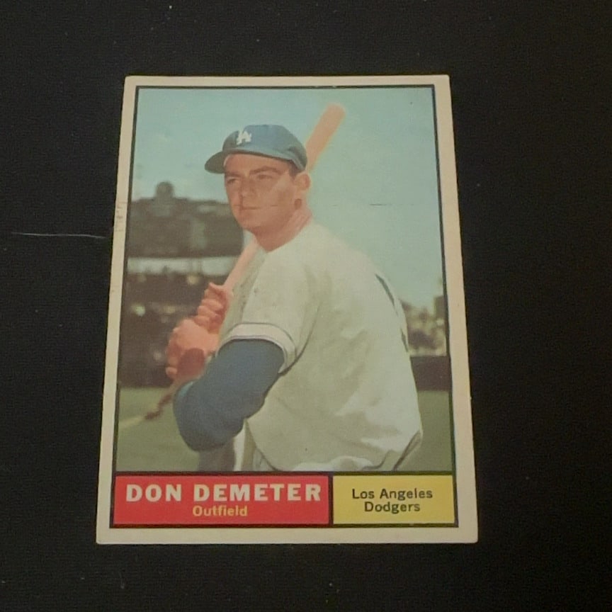 Don Demeter Los Angeles Dodgers: This is a vintage baseball card featuring Don Demeter of the Los Angeles Dodgers. The card identifies him as an outfielder and shows him in his uniform holding a baseball bat.
