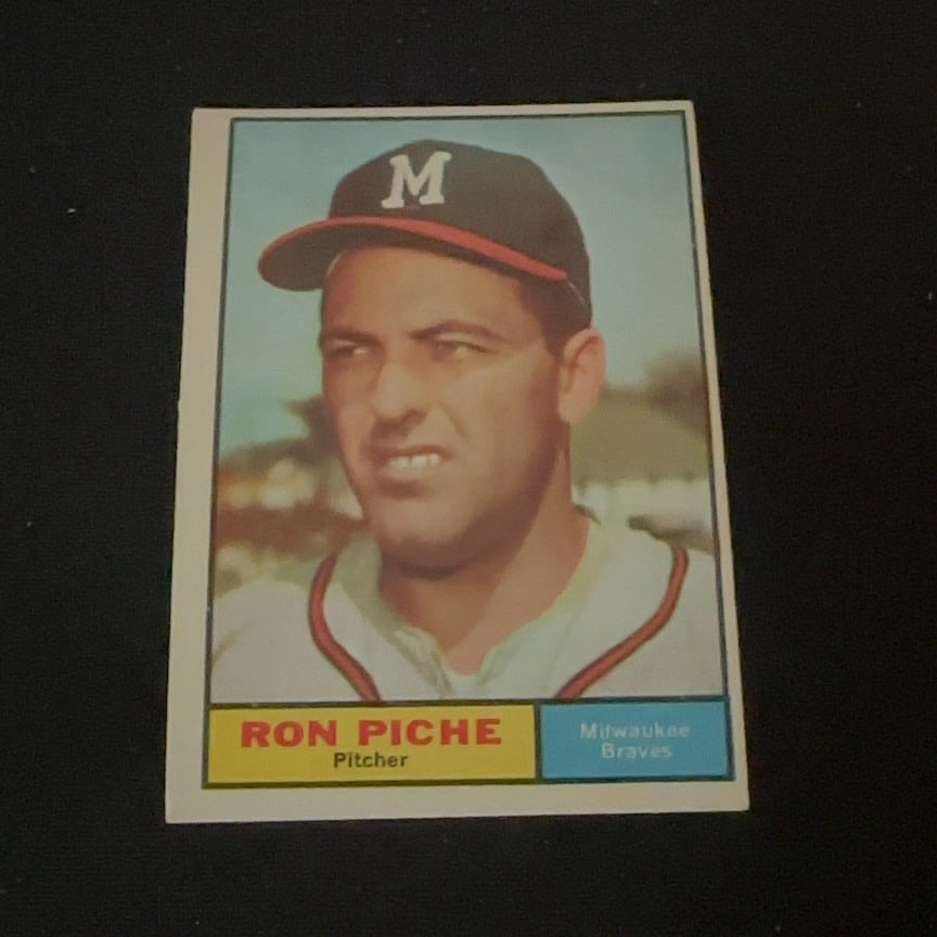 Vintage Ron Piche Milwaukee Braves Baseball Card: This is a vintage baseball card featuring professional pitcher Ron Piche. The card highlights his association with the Milwaukee Braves team.