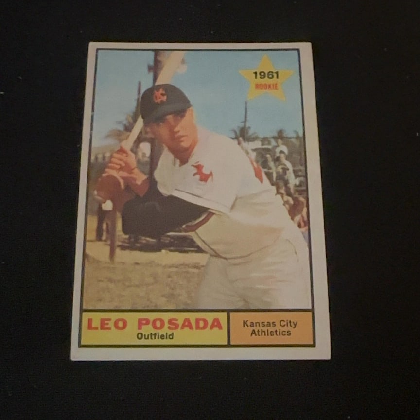 1961 Topps Leo Posada: This is a 1961 Topps baseball card featuring Leo Posada of the Kansas City Athletics. The card is labeled as a rookie card and showcases a photograph of the player at bat.