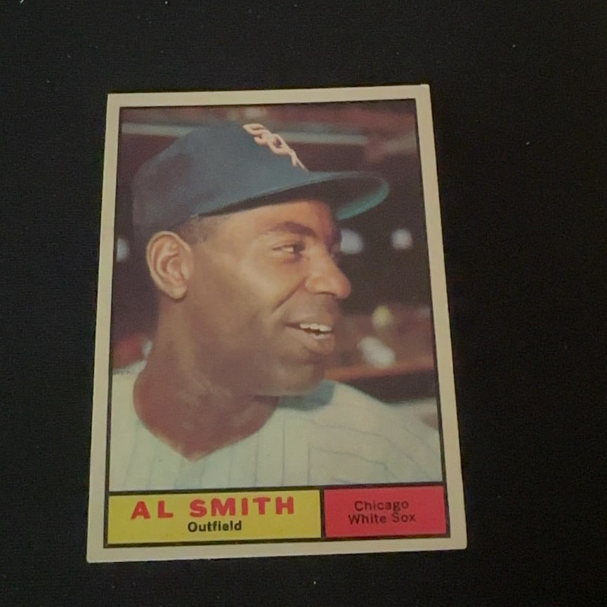 Al Smith Chicago White Sox: This is a vintage baseball card featuring Al Smith of the Chicago White Sox. The player is depicted in his team cap and uniform in an outfield position.