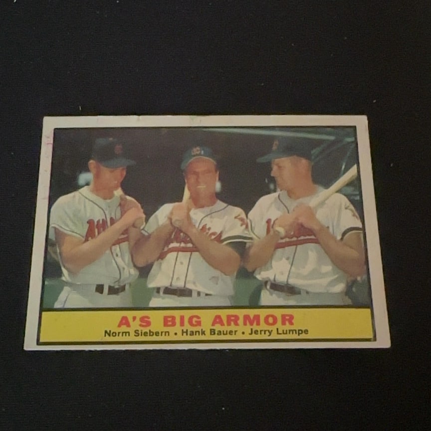 1961 Topps A's Big Armor: This is a 1961 Topps baseball card titled A's Big Armor. The card features three Kansas City Athletics players: Norm Siebern, Hank Bauer, and Jerry Lumpe.