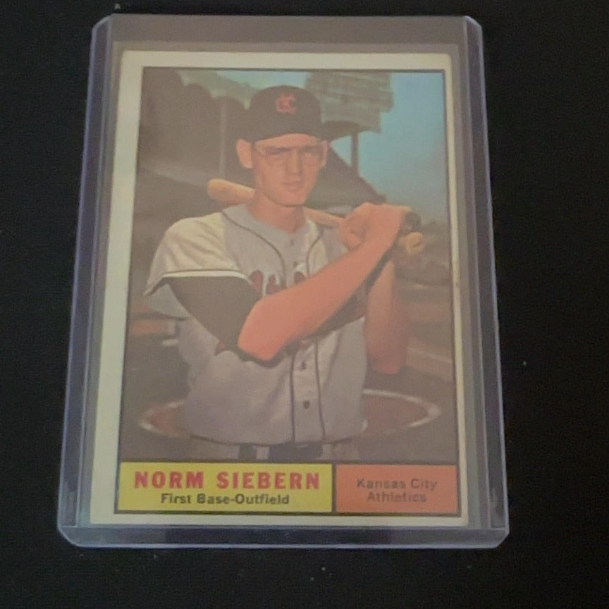 1961 Topps Norm Siebern: 1961 Topps baseball card featuring Norm Siebern of the Kansas City Athletics. The player is shown wearing his jersey and holding a bat.