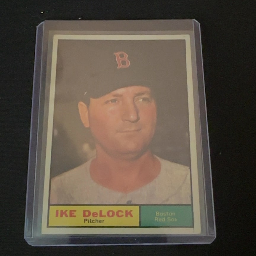 Vintage Ike DeLock Boston Red Sox Trading Card: This is a vintage trading card featuring Ike DeLock, a pitcher for the Boston Red Sox. The card showcases a portrait of the player and lists his name, position, and team affiliation on the front. It